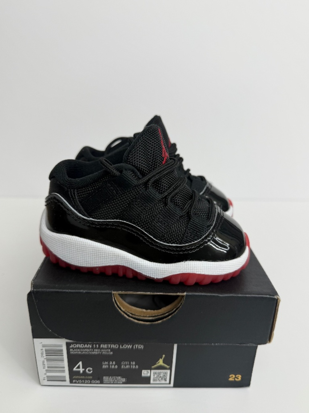 Low Jordan retro 11s red/black infant